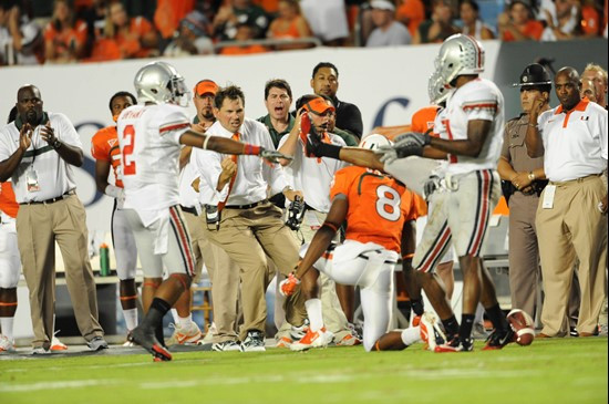 University of Miami Hurricanes head coach Al Golden ceebrates on the sidelines in a game against the Ohio State Buckeyes at Sun Life Stadium on...