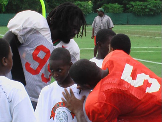 Bryan Pata and Javarris sign t-shirts for the eager students.