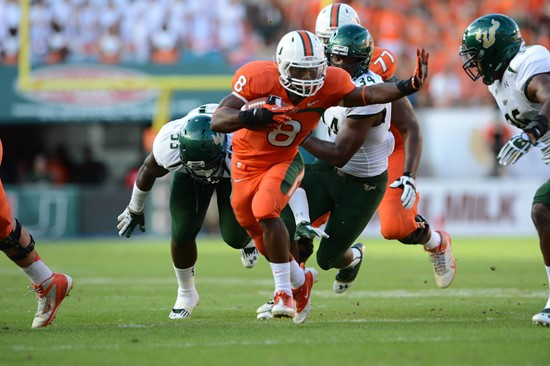 University of Miami Hurricanes running back Duke Johnson #8 plays in a game against the University of South Florida Bulls at Sun Life Stadium on...