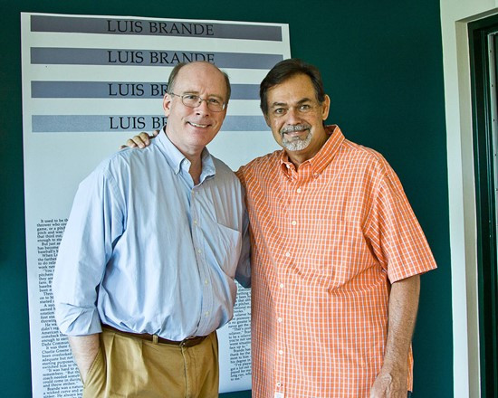 Director of Alumni Programs Rick Remmert and Luis Brande pose for a picture during a special luncheon at Mark Light Field.