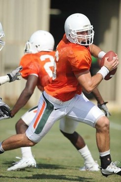 University of Miami Hurricanes quarterback Spencer Whipple #16 scrambles at Greentree Practice Field on August 13 in afternoon drills to prepare for...