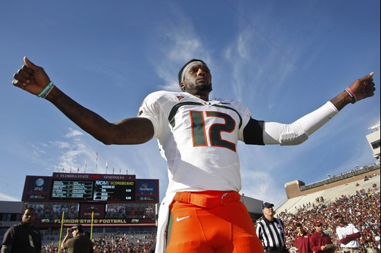Miami quarterback Jacory Harris (12) stretches prior to an NCAA college football game against Florida State on Saturday, Nov. 12, 2011, in...