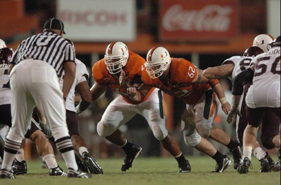 University of Miami offensive lineman Jason Fox #64 and John Rochford #62 get set to block in a game against the Texas A&M Aggies at the Orange Bowl...