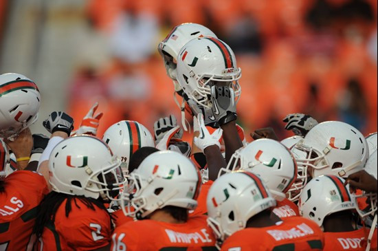 University of Miami Hurricane players meet at the 50 yard line in a sign of unity before a game against the Boston College Eagles at Sun Life Stadium...