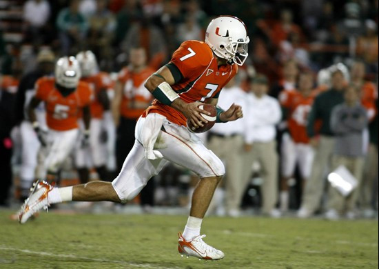Miami quarterback Kirby Freeman runs the ball against Boston College during the third quarter of a college football game, Thursday, Nov. 23, 2006, at...