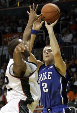 Duke's Josh McRoberts (2) shoots over Miami's Raymond Hicks in the first half of a basketball game in Coral Gables, Fla., Sunday, Jan. 14, 2007. Duke...