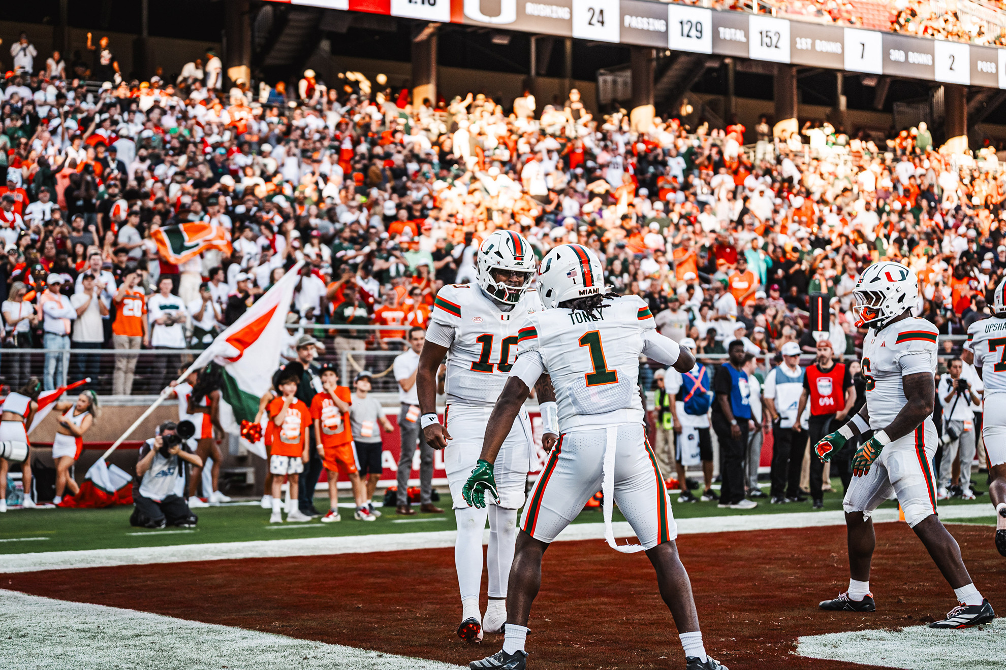 Miami's Darian Mensah and Malachi Toney celebrate during the win over Stanford.