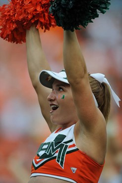 A University of Miami Hurricane cheerleader entertains fans in a game against the Deamon Deacons of Wake Forest at Dolphin Stadium on October 25,...