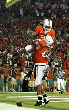 Joel Figueroa and Travis Benjamin celebrate after Benjamin scored the second touchdown of the third quarter.