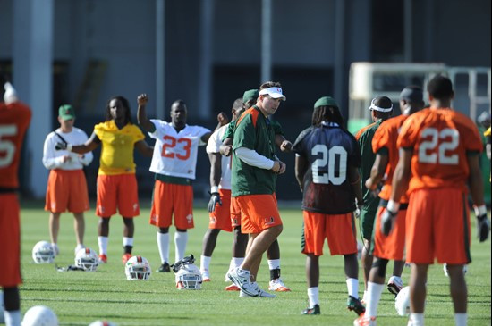 University of Miami Head Coach, Al Golden, instructs his team on how he wants them to execute his game plan during a spring practice at Greentree...