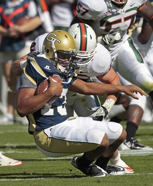 Georgia Tech quarterback Tevin Washington (13) is sacked by Miami linebacker Colin McCarthy (44) in the first quarter of an NCAA college football game...