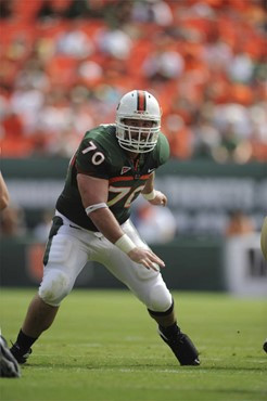 University of Miami Hurricanes guard J.J. Trump #70 gets set to block in a game against the Deamon Deacons of Wake Forest at Dolphin Stadium on...