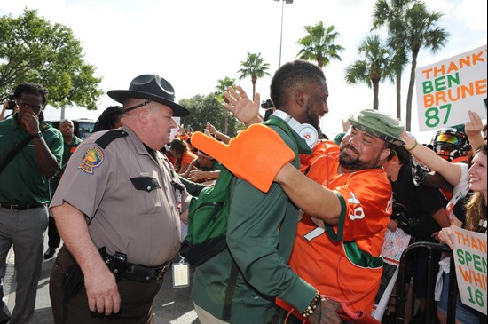 University of Miami Hurricanes quarterback Jacory Harris and a fan enjoying there last game against  Boston College Eagles at Sun Life Stadium on...