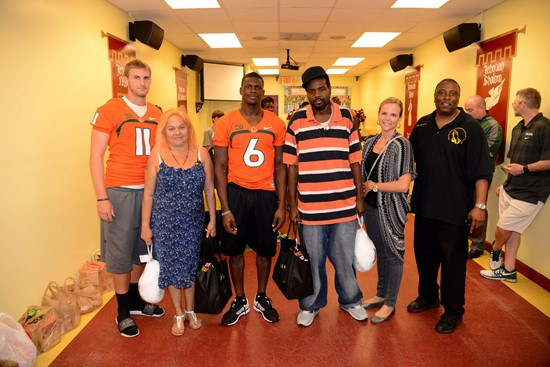 Players and coaches' wives took photos with several families Tuesday afternoon