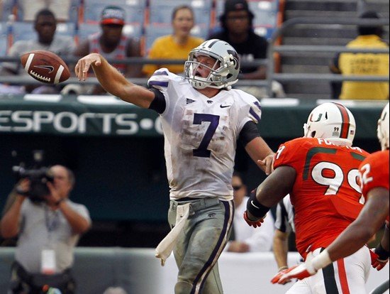 Miami's Marcus Forston (99) chases down Kansas State quarterback Collin Klein (7) as he loses control of the ball in the third quarter of an NCAA...