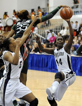 Miami guard Suriya McGuire (33) and Georgetown guard Sugar Rodgers (14) vie for a rebound during second half of an NCAA college basketball game,...