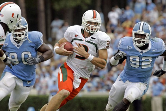 Kyle Wright is pressured by North Carolina's Kentwan Balmer (90) and E.J. Wilson (92) during the second half. (AP Photo/Gerry Broome)