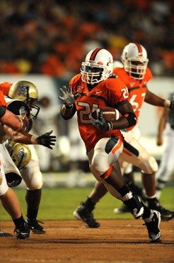 University of Miami Hurricanes running back, Derron Thomas #21, rushed 8 times for 35 yards, caught 1 pass for 19 yards, and scored 1 touchdown in a...