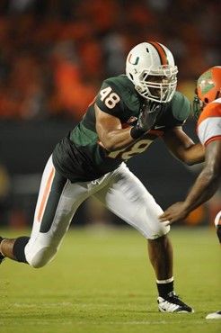 University of Miami Hurricanes defensive lineman Andrew Smith #48 plays in a game against the Florida A&M Rattlers at Land Shark Stadium on October...