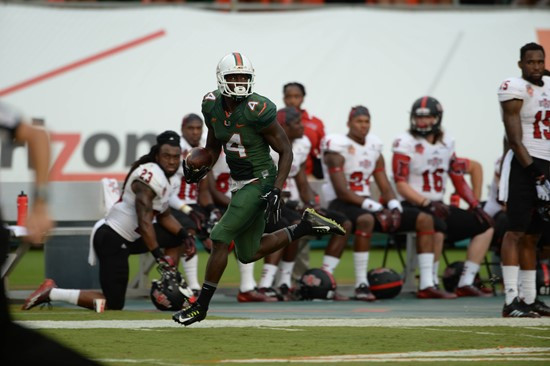 University of Miami Hurricanes wide receiver Phillip Dorsett #4 plays in a game against the Arkansas State Red Wolves at Sun Life Stadium on...