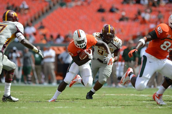 University of Miami Hurricanes running back Eduardo Clements #23 plays in a game against the Bethune Cookman Wildcats at Sun Life Stadium on September...