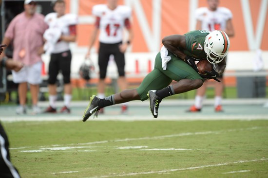 University of Miami Hurricanes wide receiver Phillip Dorsett #4 plays in a game against the Arkansas State Red Wolves at Sun Life Stadium on...