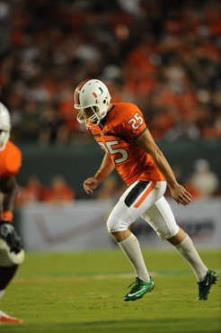 University of Miami Hurricanes kicker/punter Matt Bosher #25 kicks an extra point in a game against the Florida State Seminoles at Sun Life Stadium on...