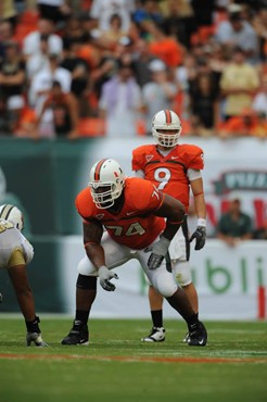 University of Miami Hurricanes offensive lineman Orlando Franklin #74 and quarterback Robert Marve #9 in a game against the University of Central...
