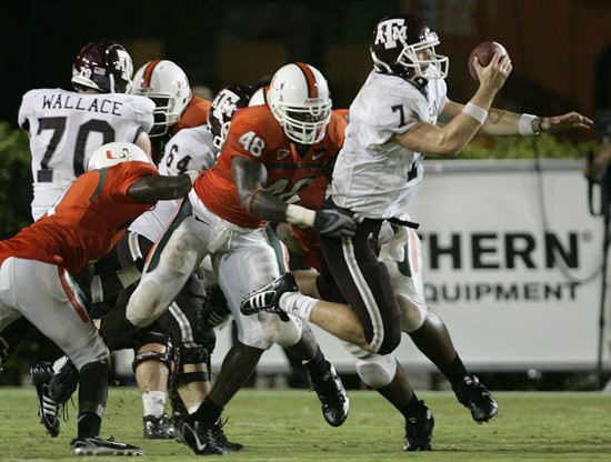 Texas A&M quarterback Stephen McGee (7) is stopped at the 2-yard line by Miami linebacker Spencer Adkins (48) in the fourth quarter. (AP Photo/Lynne...
