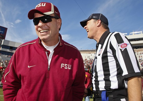 Florida State head coach Jimbo Fisher, left, shares a laugh with an official prior to an NCAA college football game against Miami on Saturday, Nov....