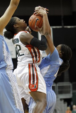 Shenise Johnson is fouled by North Carolina's Brittany Rountree. (AP Photo/Alan Diaz)