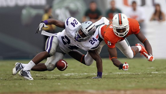 Miami's Tommy Streeter (8) is unable to catch a pass as Kansas State's Nigel Malone (24) gets in front of the ball. (AP Photo/J Pat Carter)