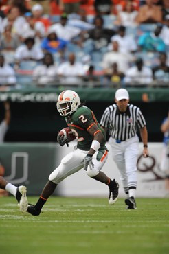 University of Miami Hurricanes running back Graig Cooper #2 plays in a game against the Deamon Deacons of Wake Forest at Dolphin Stadium on October...