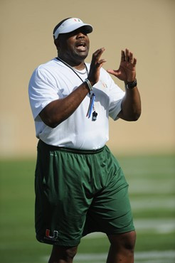 University of Miami Defenisve Line Coach, Jethro Franklin, instructs his team on how he wants them to execute his game plan during a spring practice...