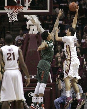 Florida State's Kiel Turpin shoots over the defense of Miami's Julian Gamble during the first half of an NCAA college basketball game Wednesday, Feb....