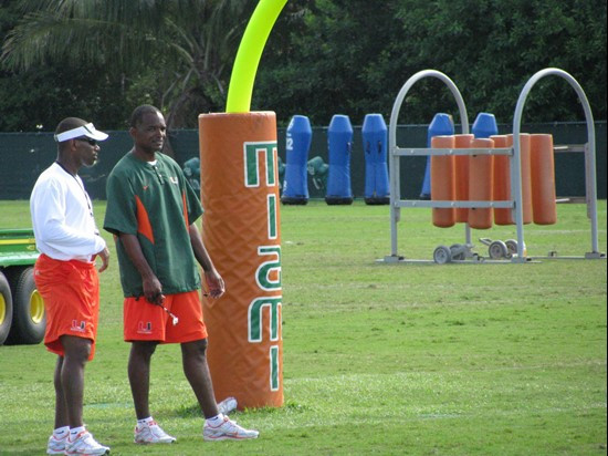 Andreu Swasey (L) and Randy Shannon (R) at practice Monday morning at the Greentree Practice Fields.