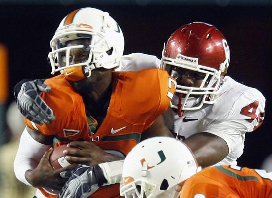 Jacory Harris is tackled by Oklahoma defensive end Jeremy Beal.