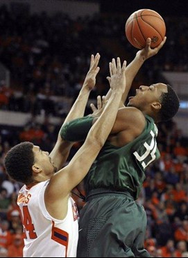 Miami's Kenny Kadji (35) shoots over Clemson's Milton Jennings (24) in the first half of an NCAA college basketball game, Sunday, Feb. 17, 2013, in...