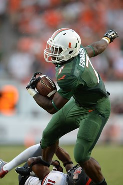 University of Miami Hurricanes running back Gus Edwards #7 scores a touchdown at the end of the first half in a game against the Arkansas State Red...