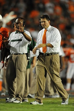 University of Miami Hurricanes head coach Al Golden calls in a play in a game against the Ohio State Buckeyes at Sun Life Stadium on September 17,...