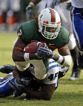 Miami running back Graig Cooper (2) is tackled by Duke linebacker Austin Gamble (45) during the fourth quarter of an NCAA college football game in...