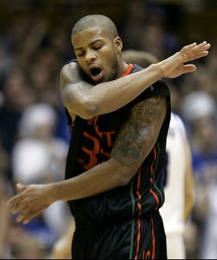 Miami's Jack McClinton reacts after a foul during the second half of a college basketball game against Duke in Durham, N.C., Saturday, Feb. 2, 2008....