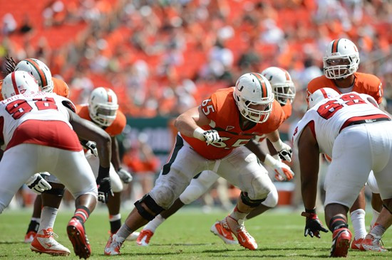 University of Miami Hurricanes offensive lineman Brandon Linder #65 and the Canes take on the North Carolina State Wolfpack at Sun Life Stadium on...