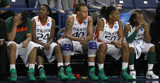 Miami players sit  on the bench late in the second half of an NCAA tournament second-round women's college basketball game against Gonzaga in Spokane,...