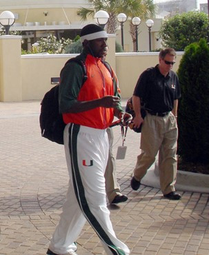 Malcolm Grant heads to the bus to depart for the tournament opener vs. Tulane.