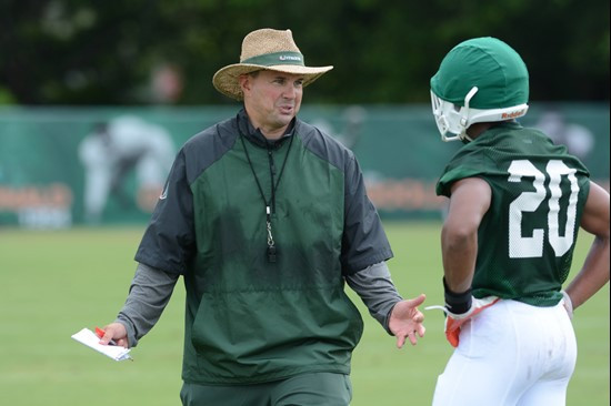 Head coach Al Golden and Ray Lewis III