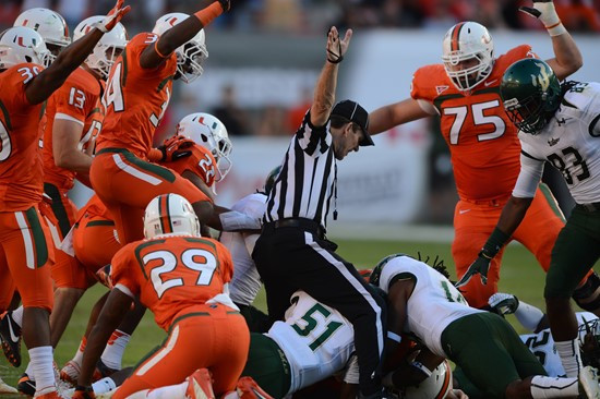 The university of Miami recover a fumble at game versus the University of South Florida Bulls at Sun Life Stadium on November 17, 2012. Photo by...