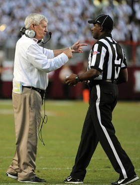 Virginia Tech head coach Frank Beamer speaks to an official during the second half of an NCAA college football game Saturday, Oct. 8, 2011, in...