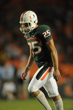 University of Miami Hurricanes kicker/punter Matt Bosher #25 kicks in a game against the North Carolina Tar Heels at Sun Life Stadium on October 23,...