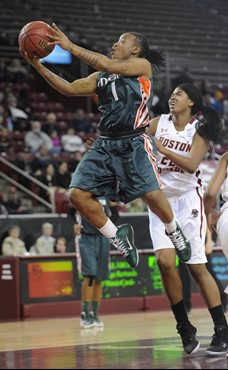 Miami's Riquna Williams (1) drives past Boston College's Joy Caracciolo. (AP Photo/Gretchen Ertl)